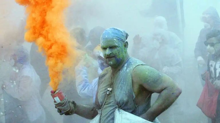 Watch live: Greek revellers throw coloured flour at each other in 200-year-old carnival tradition