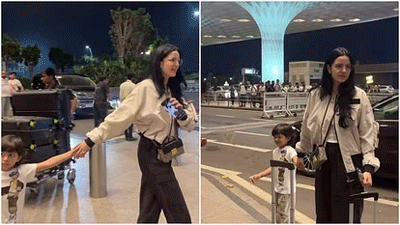 Natasha spotted at airport with son