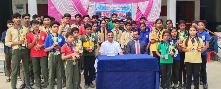 Children raise the flag in an inter-house chess match