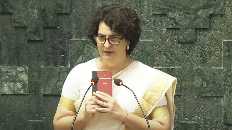 Priyanka Gandhi was sworn in as a Member of Parliament, sitting in the fourth row behind Rahul, holding a copy of the Constitution in her hand.